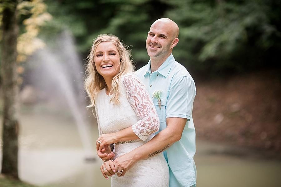Hugs from behind at this Parkside Resort Destination Wedding by Knoxville Wedding Photographer, Amanda May Photos.
