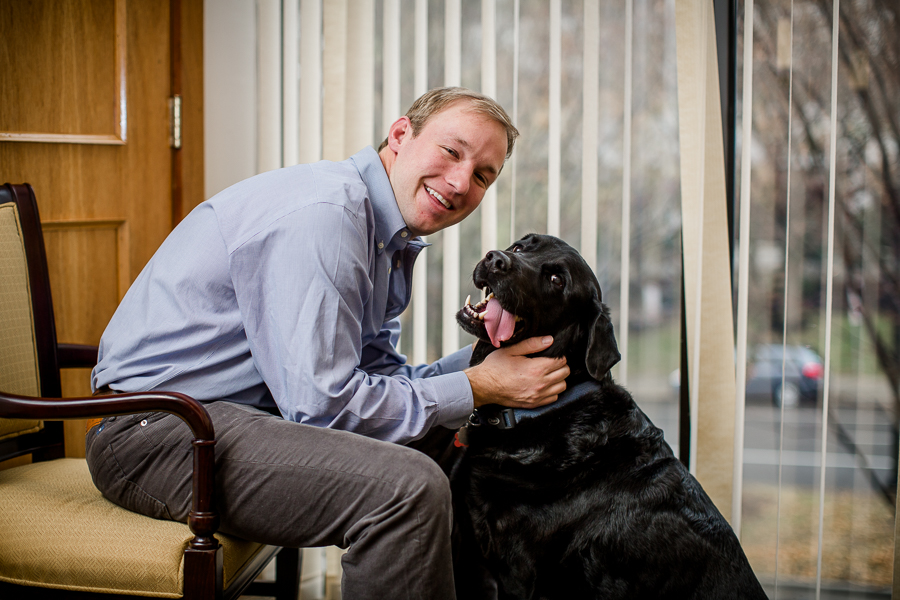 Groom with his dog during this getting ready picture at this winter wedding at Knoxville Wedding Venue, Jackson Terminal, by Knoxville Wedding Photographer, Amanda May Photos.