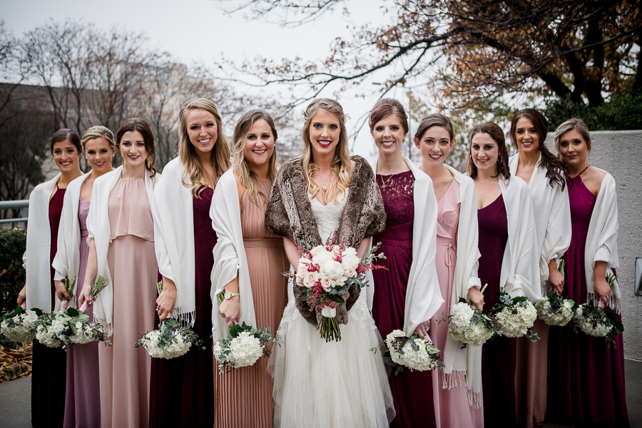 during the bride and bridesmaids pictures at this winter wedding at Knoxville Wedding Venue, Jackson Terminal, by Knoxville Wedding Photographer, Amanda May Photos.