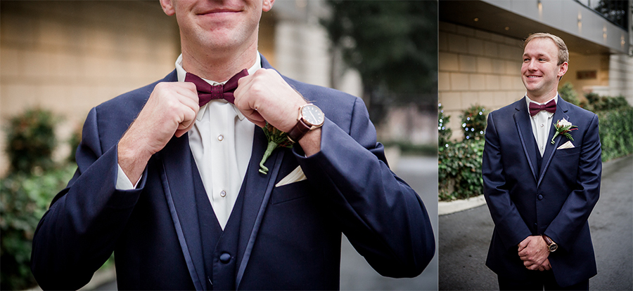 Straightening his tie during the groom and groomsmen pictures at this winter wedding at Knoxville Wedding Venue, Jackson Terminal, by Knoxville Wedding Photographer, Amanda May Photos.