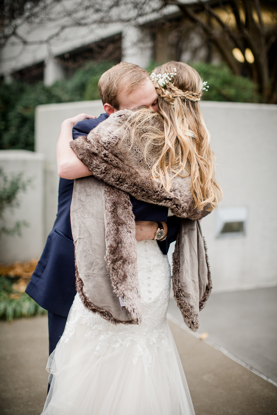 Big hug during the first look pictures at this winter wedding at Knoxville Wedding Venue, Jackson Terminal, by Knoxville Wedding Photographer, Amanda May Photos.