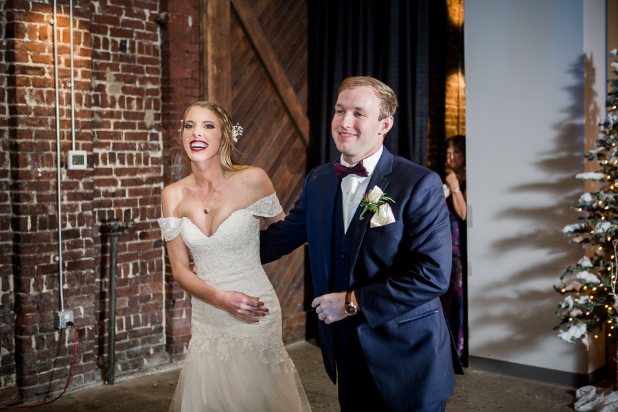 Bride and groom introduced during the reception pictures at this winter wedding at Knoxville Wedding Venue, Jackson Terminal, by Knoxville Wedding Photographer, Amanda May Photos.