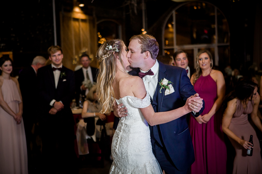 First dance kiss during the reception pictures at this winter wedding at Knoxville Wedding Venue, Jackson Terminal, by Knoxville Wedding Photographer, Amanda May Photos.