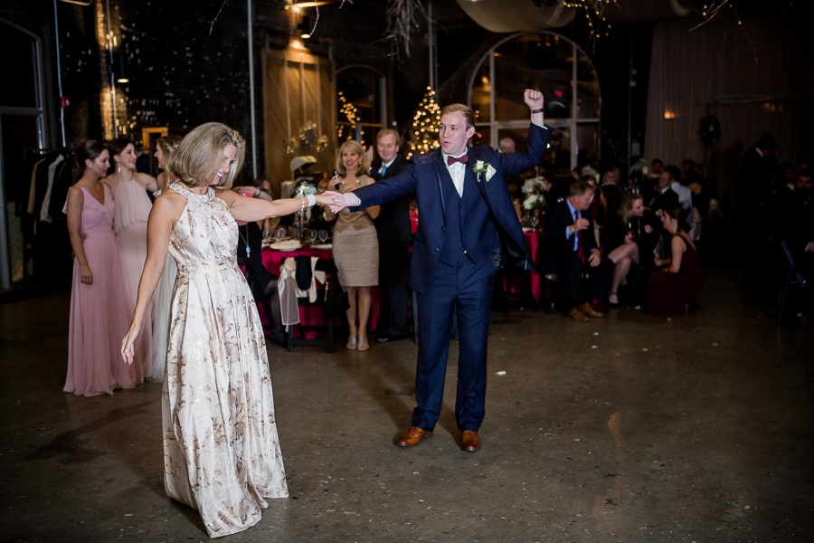 Mother and son dance during the reception pictures at this winter wedding at Knoxville Wedding Venue, Jackson Terminal, by Knoxville Wedding Photographer, Amanda May Photos.