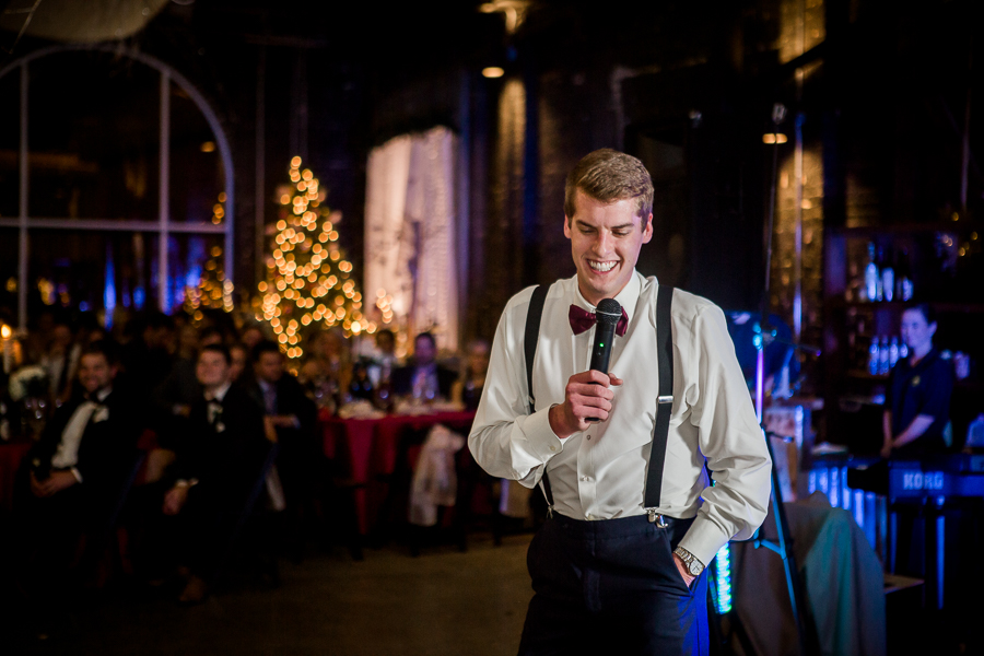 Bride's brother giving a toast during the reception pictures at this winter wedding at Knoxville Wedding Venue, Jackson Terminal, by Knoxville Wedding Photographer, Amanda May Photos.