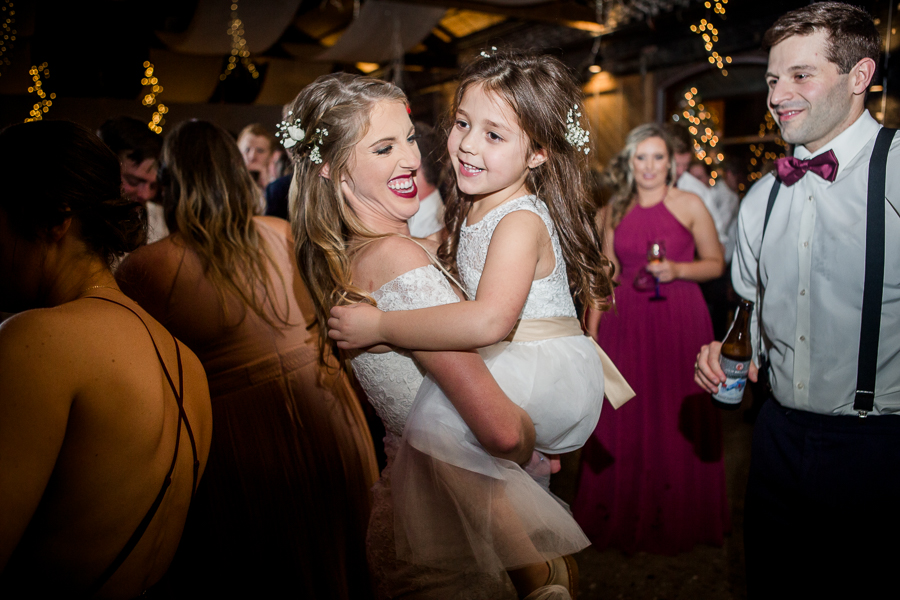 Bride and her niece dancing during the dancing reception pictures at this winter wedding at Knoxville Wedding Venue, Jackson Terminal, by Knoxville Wedding Photographer, Amanda May Photos.