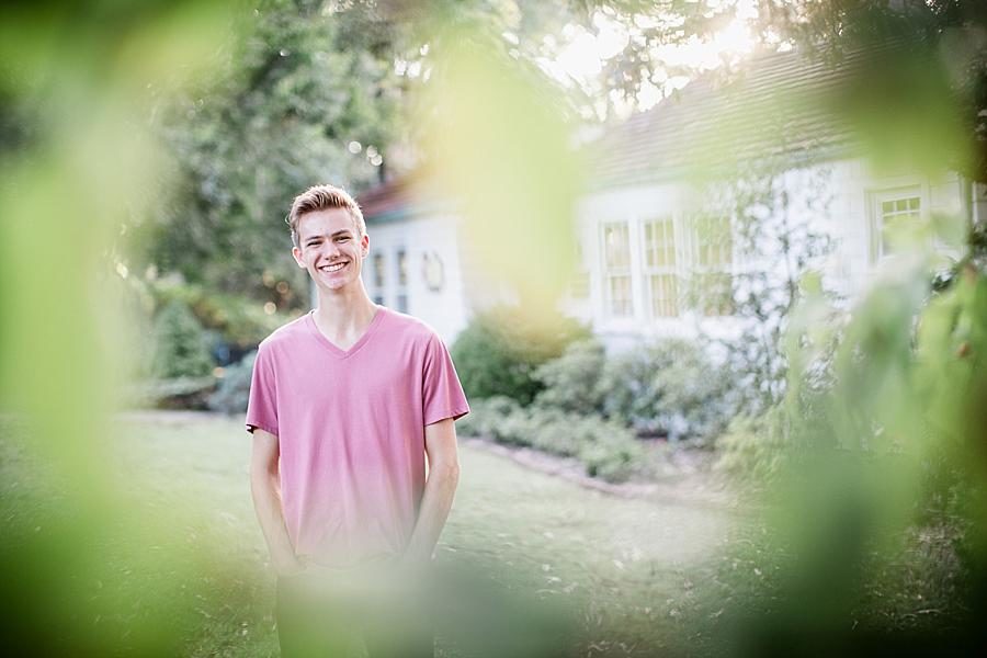 Through the leaves at this Knoxville Botanical Gardens Senior Session by Knoxville Wedding Photographer, Amanda May Photos.