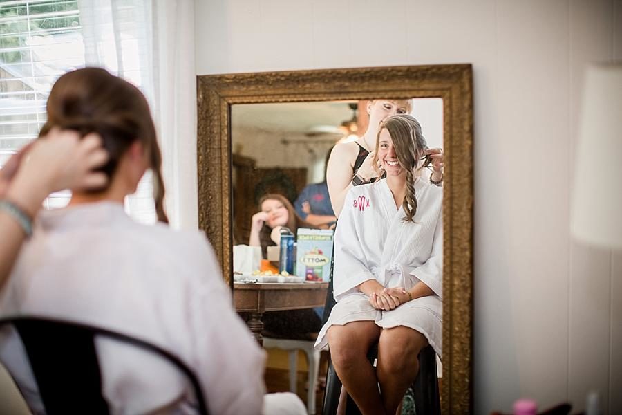 Getting her hair done at this RiverView Family Farm Wedding by Knoxville Wedding Photographer, Amanda May Photos.