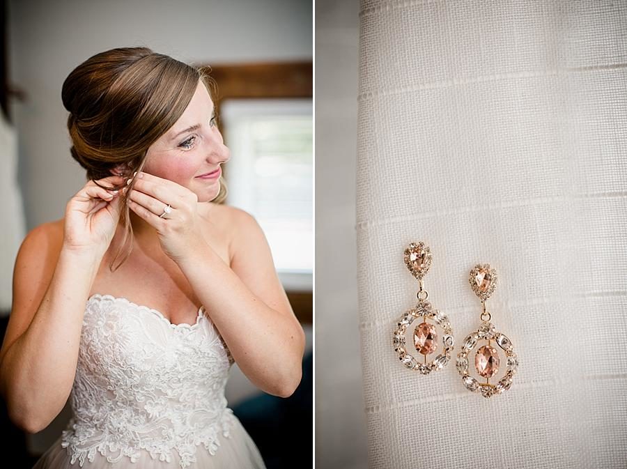 Putting on earrings at this RiverView Family Farm Wedding by Knoxville Wedding Photographer, Amanda May Photos.