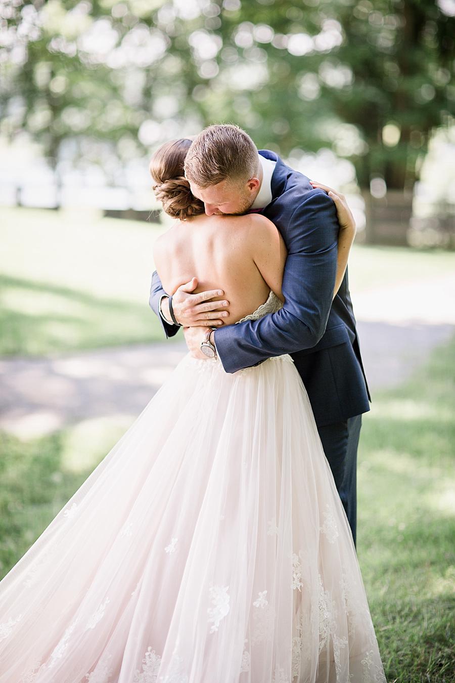 First look hug at this RiverView Family Farm Wedding by Knoxville Wedding Photographer, Amanda May Photos.