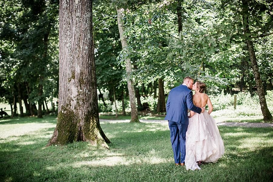 Kisses in the woods at this RiverView Family Farm Wedding by Knoxville Wedding Photographer, Amanda May Photos.