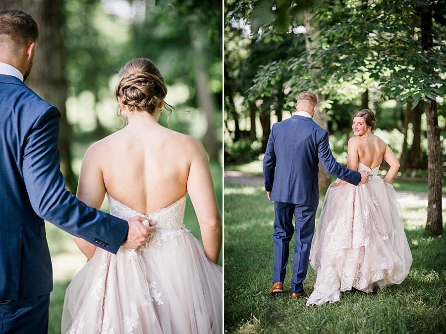 Helping hold the dress at this RiverView Family Farm Wedding by Knoxville Wedding Photographer, Amanda May Photos.