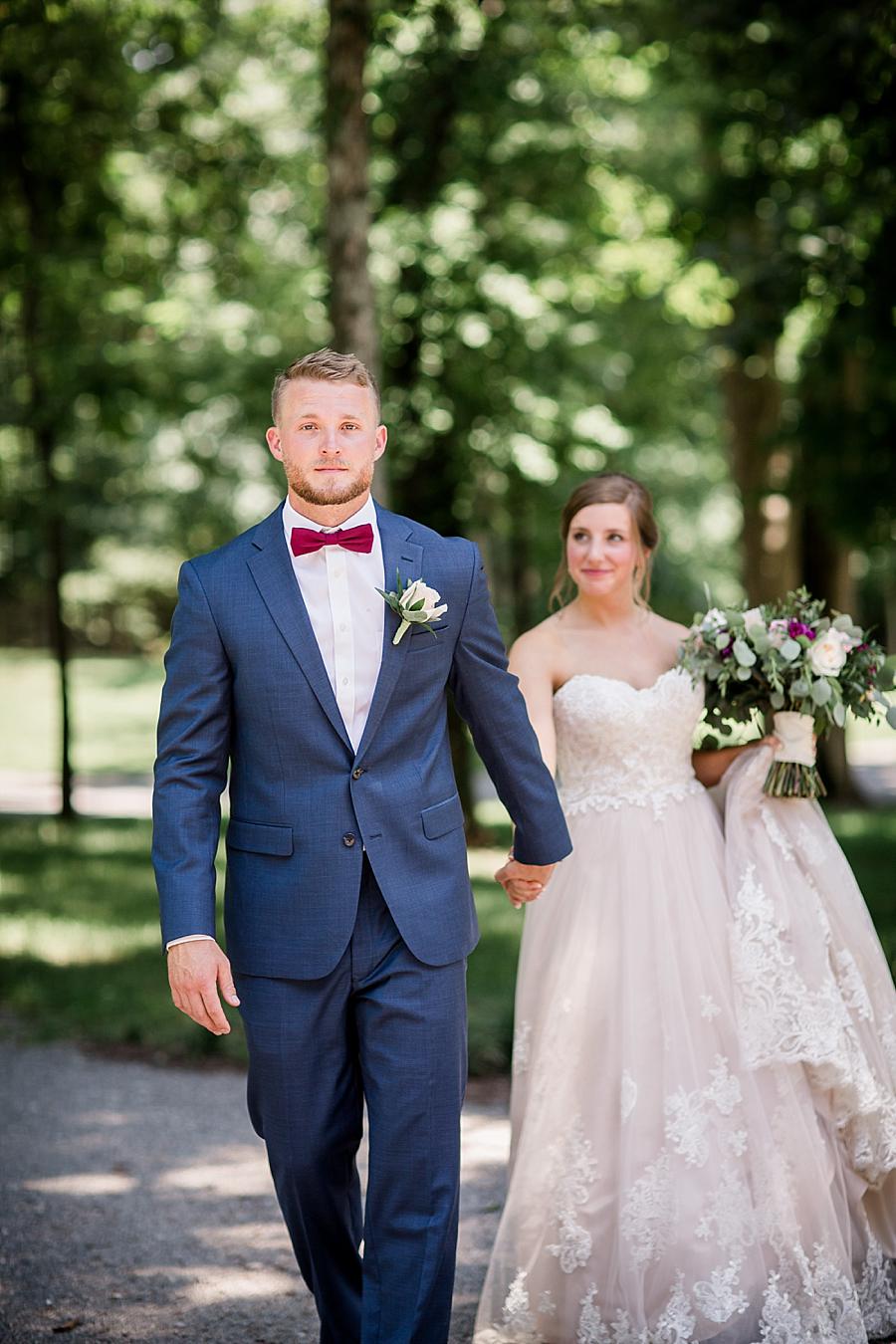 Groom leading his bride at this RiverView Family Farm Wedding by Knoxville Wedding Photographer, Amanda May Photos.