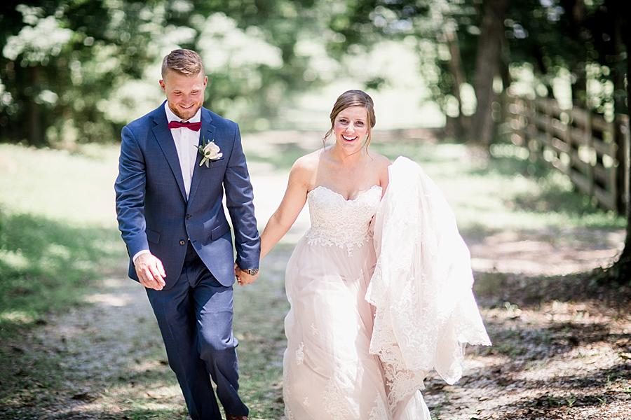 Walking down the path at this RiverView Family Farm Wedding by Knoxville Wedding Photographer, Amanda May Photos.