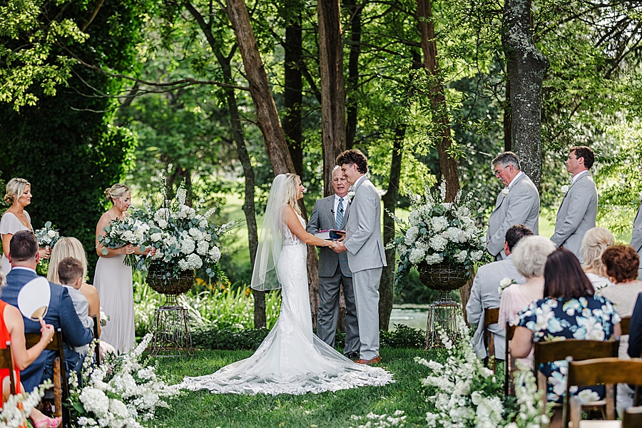 exchanging vows at this marblegate farm wedding