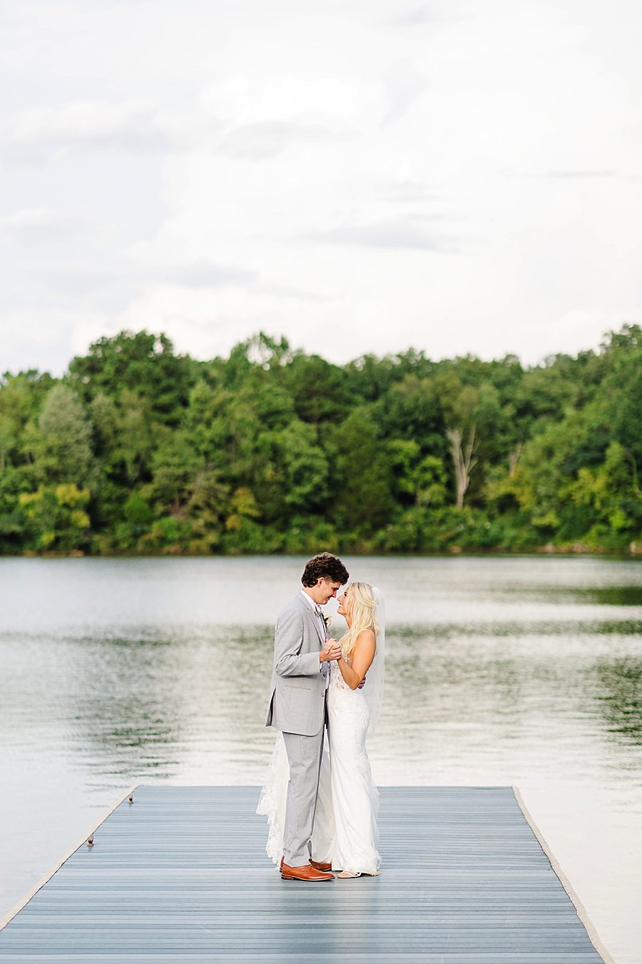 couple by the water at this marblegate farm wedding
