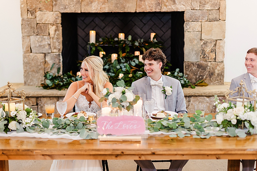 couple sitting at head table 