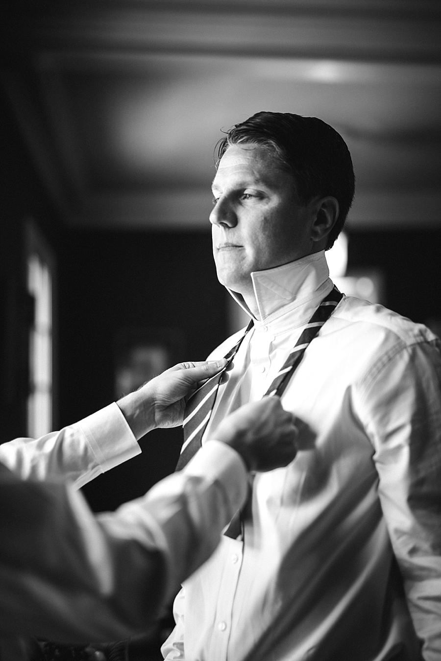 Groom getting ready at this East Ivy Mansion Wedding session by Knoxville Wedding Photographer, Amanda May Photos.