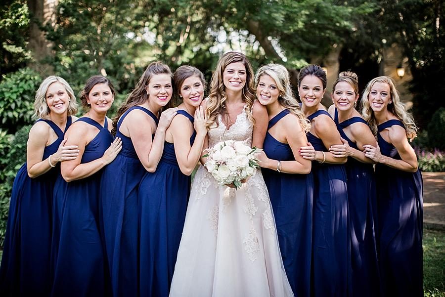 Bridesmaids hugging bride at this East Ivy Mansion Wedding session by Knoxville Wedding Photographer, Amanda May Photos.