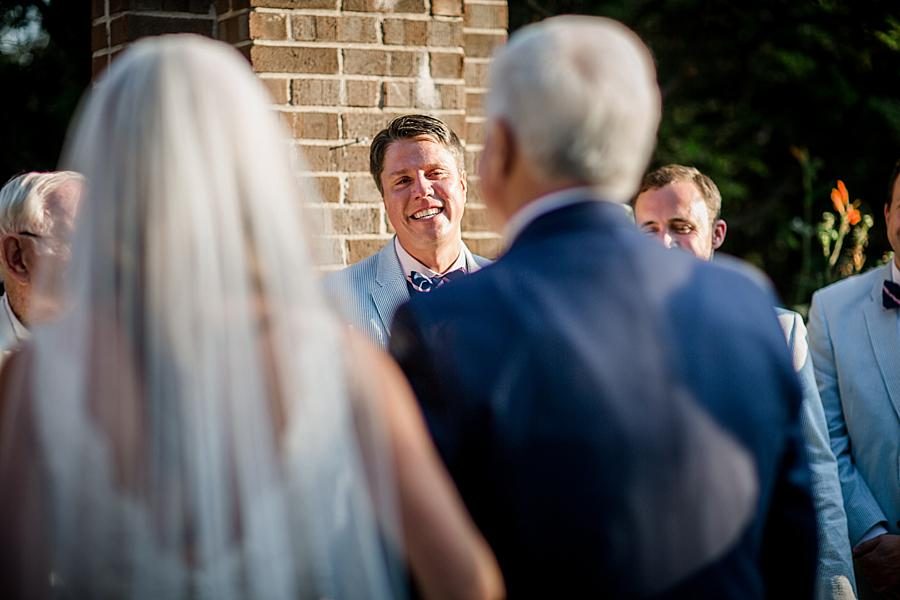 Groom smiling with bride walking down aisle at this East Ivy Mansion Wedding session by Knoxville Wedding Photographer, Amanda May Photos.
