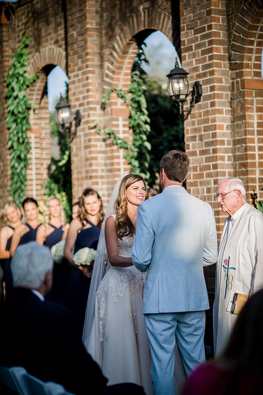 Holding hands at the alter at this East Ivy Mansion Wedding session by Knoxville Wedding Photographer, Amanda May Photos.