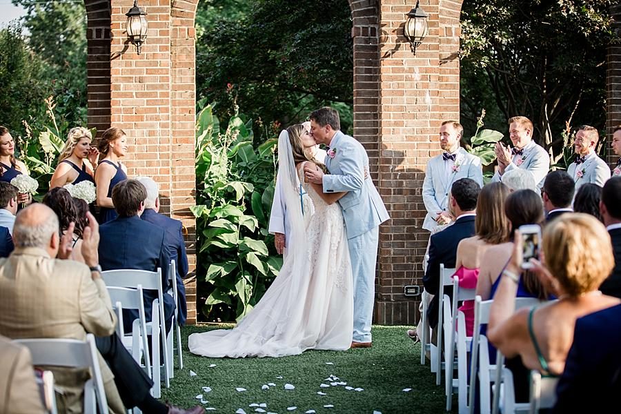 First kiss at the alter at this East Ivy Mansion Wedding session by Knoxville Wedding Photographer, Amanda May Photos.