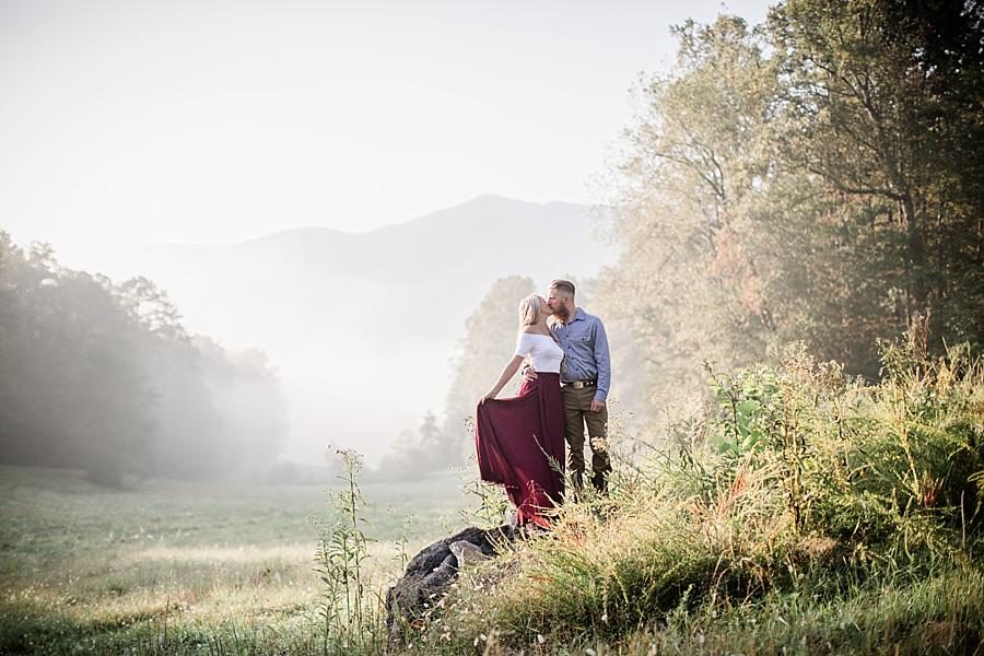 Kissing in grass at this Townsend Anniversary session by Knoxville Wedding Photographer, Amanda May Photos.