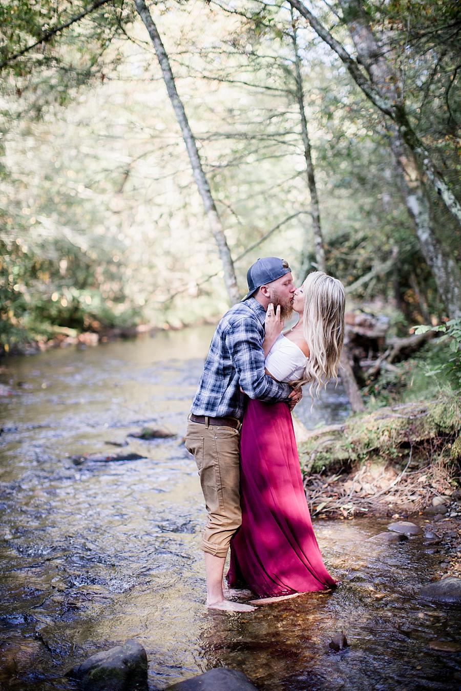 Kissing in creek at this Townsend Anniversary session by Knoxville Wedding Photographer, Amanda May Photos.