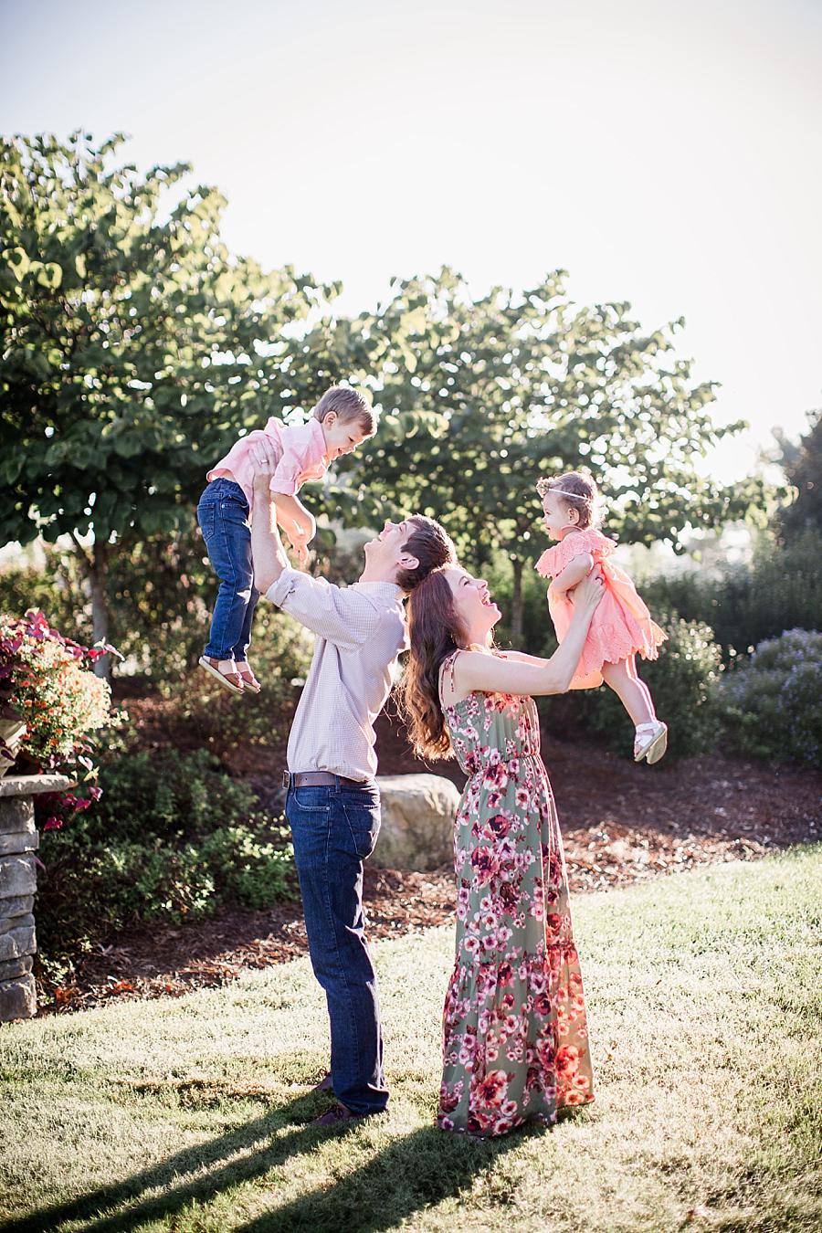 Holding the kids at this Shelby Bottoms Park family session by Knoxville Wedding Photographer, Amanda May Photos.