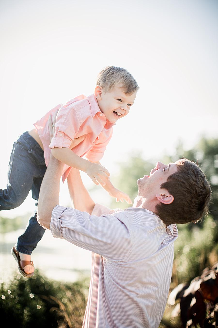 Playing airplane at this Shelby Bottoms Park family session by Knoxville Wedding Photographer, Amanda May Photos.