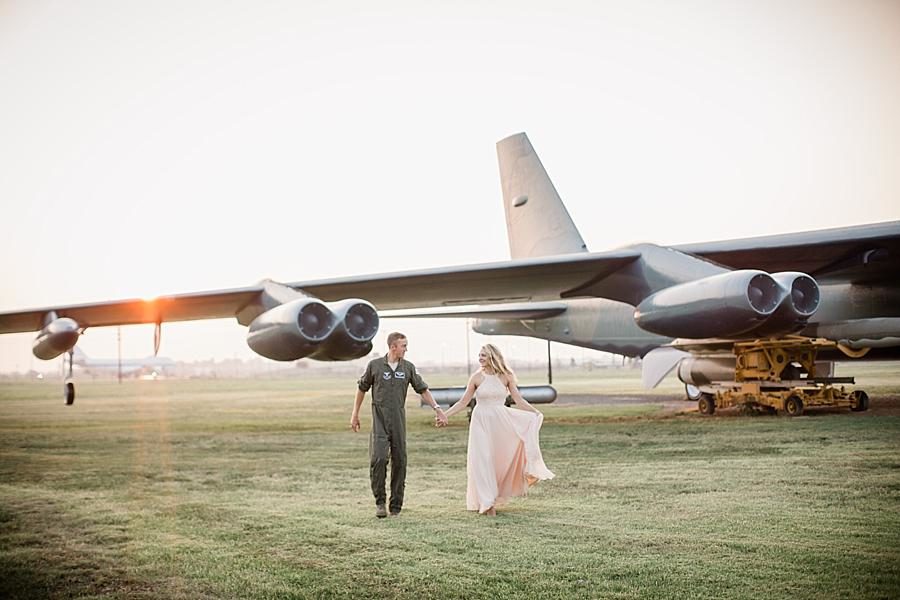 Walking on the base at this Air Force Engagement Session by Knoxville Wedding Photographer, Amanda May Photos.