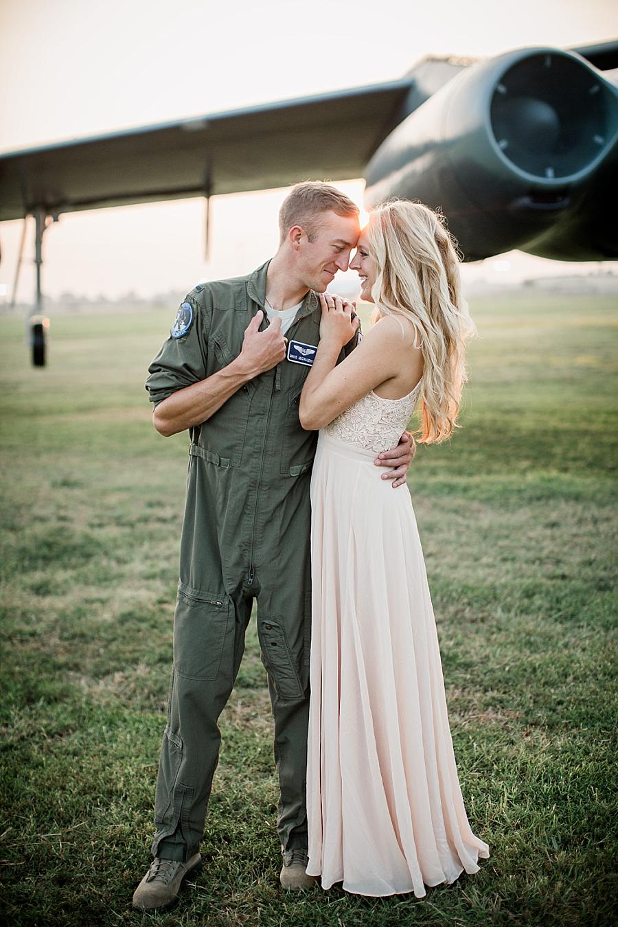 By the engine at this Air Force Engagement Session by Knoxville Wedding Photographer, Amanda May Photos.