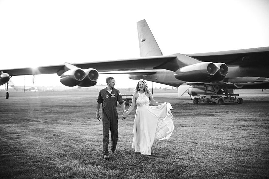 Holding her skirt at this Air Force Engagement Session by Knoxville Wedding Photographer, Amanda May Photos.