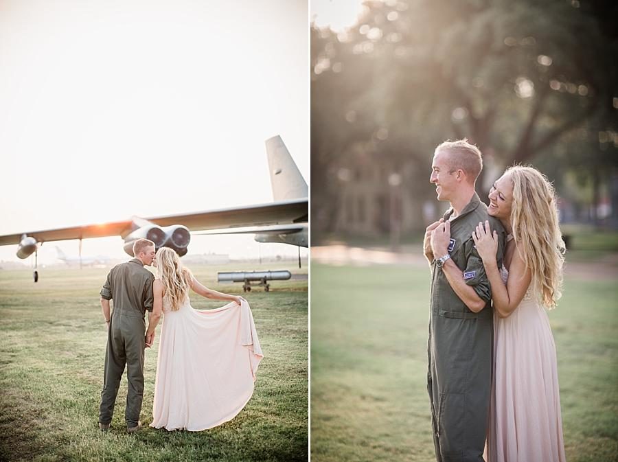 Kisses by the plane at this Air Force Engagement Session by Knoxville Wedding Photographer, Amanda May Photos.