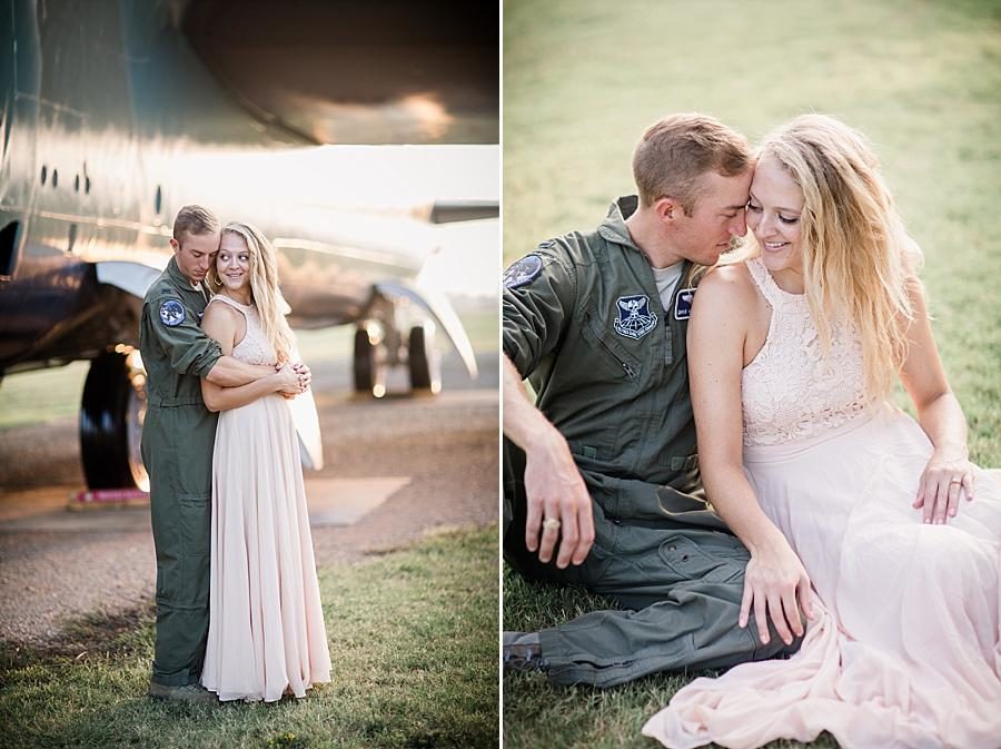 Sitting in the grass at this Air Force Engagement Session by Knoxville Wedding Photographer, Amanda May Photos.