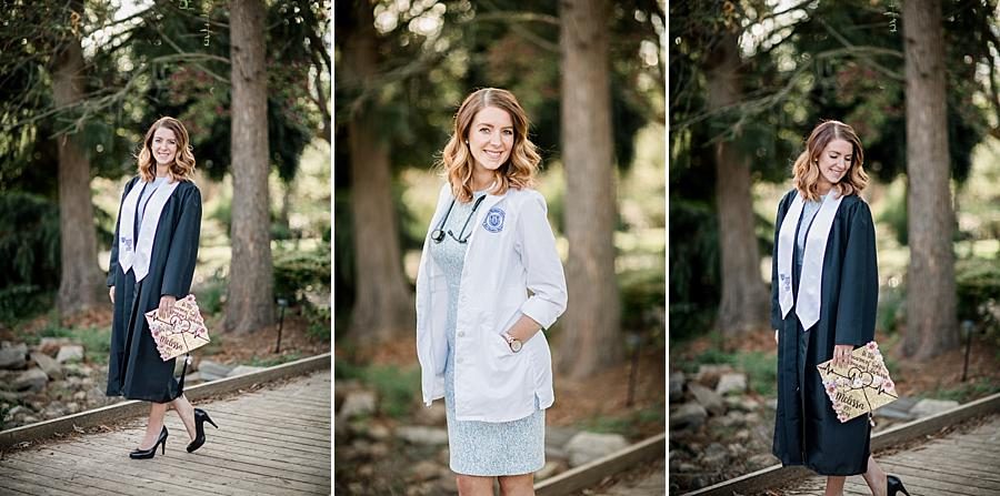 Cap and gown at this Volunteer Landing & UT Gardens Senior Session by Knoxville Wedding Photographer, Amanda May Photos.