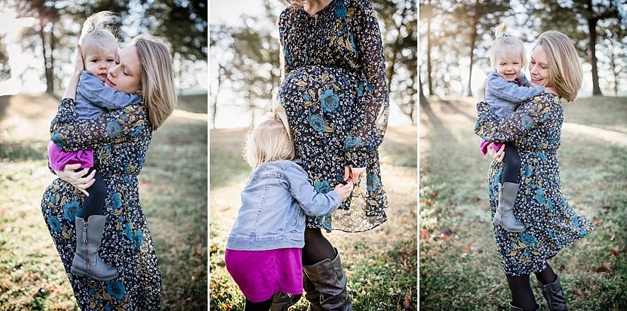 Hugging mommy's belly at this concord park family session by Knoxville Wedding Photographer, Amanda May Photos.