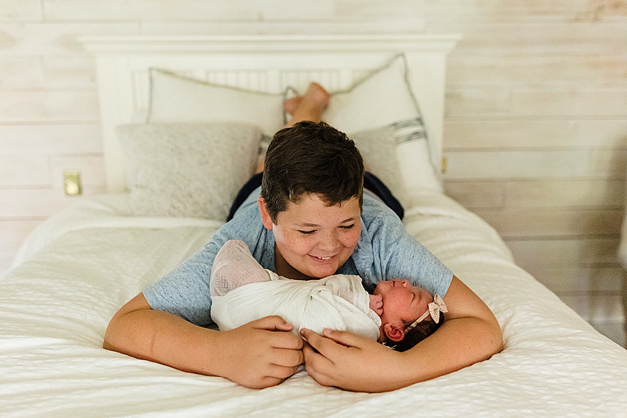 brother holding sister at this newborn session