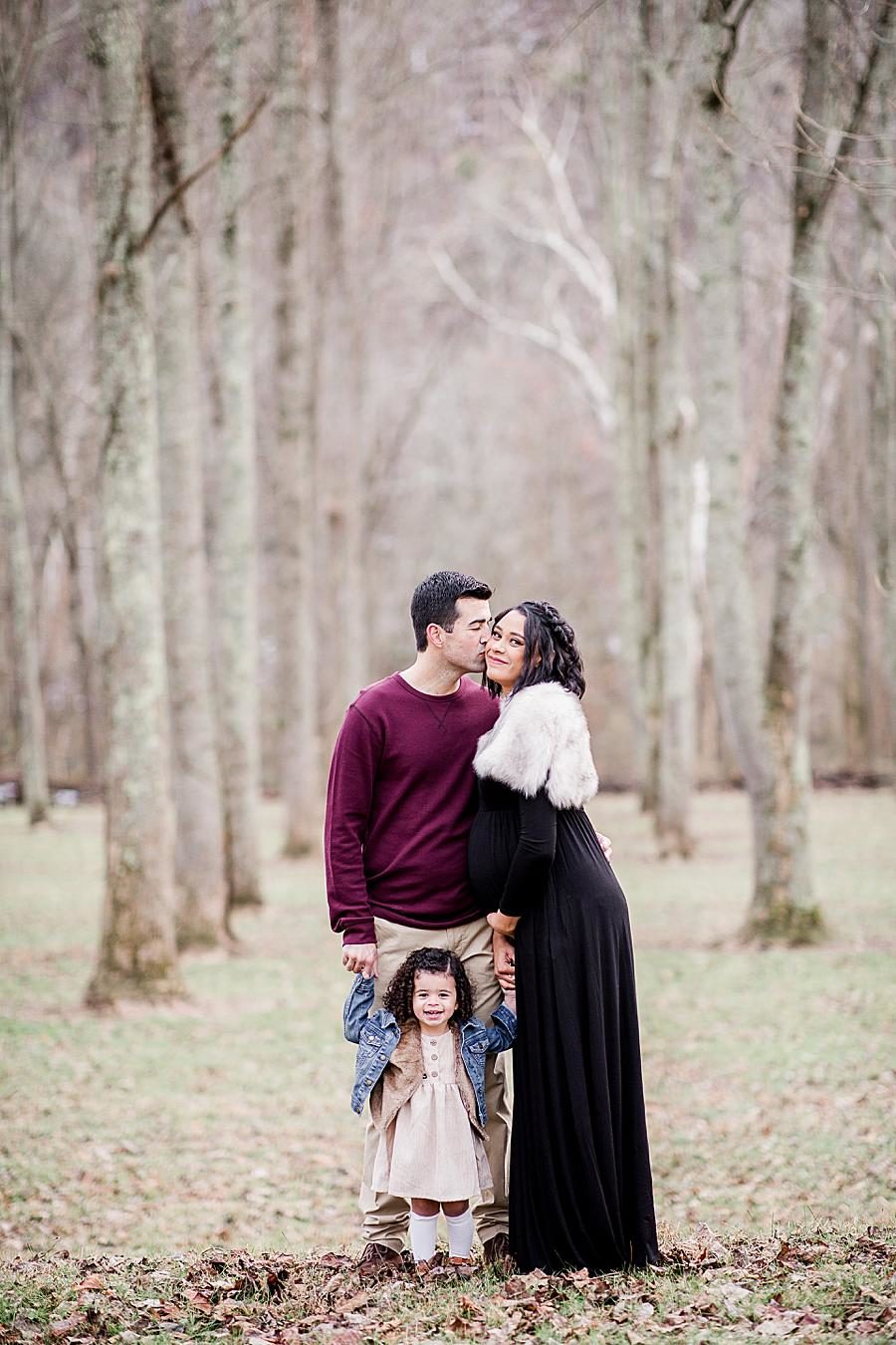 Kiss on the cheek at this Norris Dam maternity by Knoxville Wedding Photographer, Amanda May Photos.