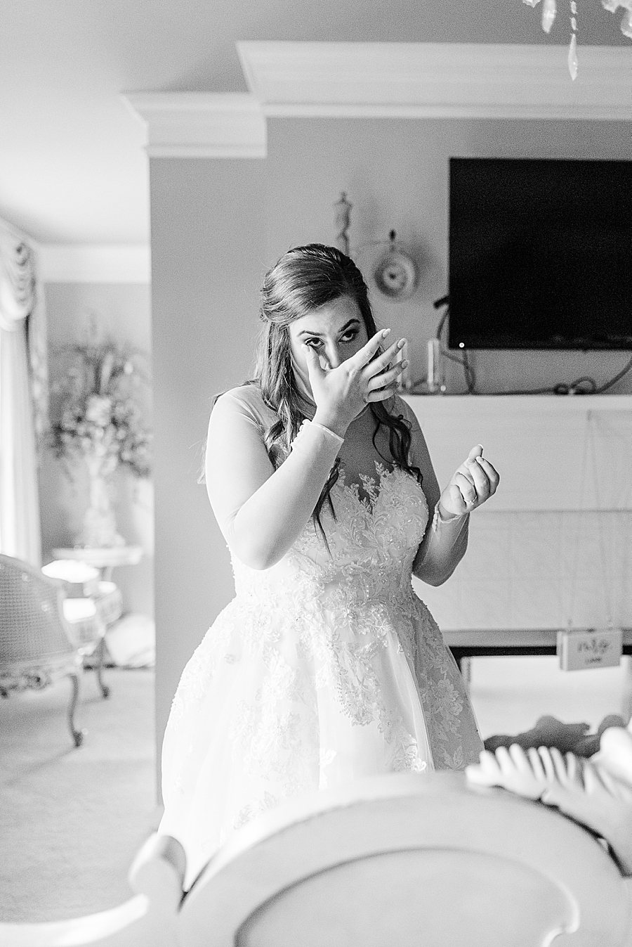 Black and white photo of teary bride