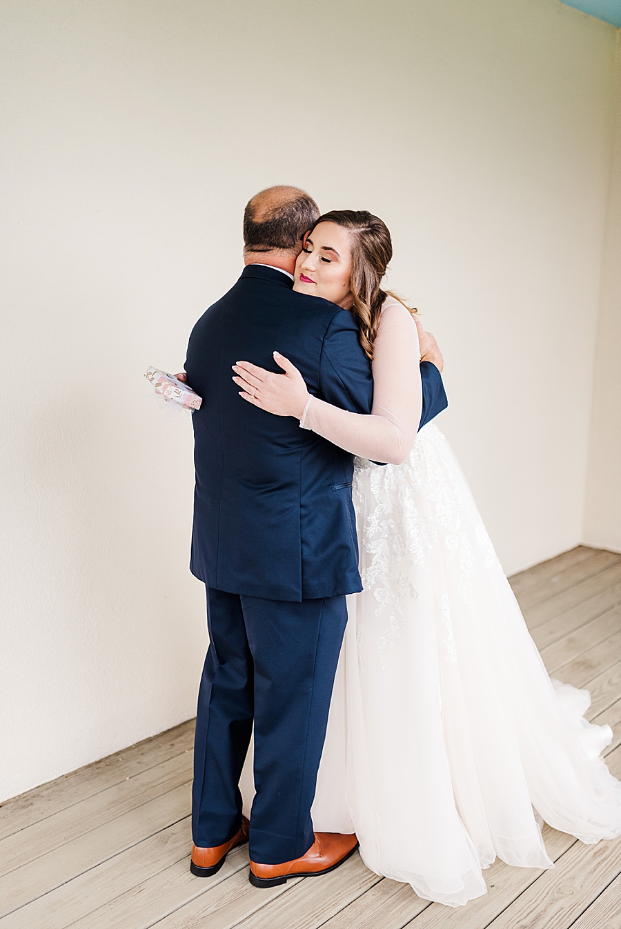 Bride hugging dad