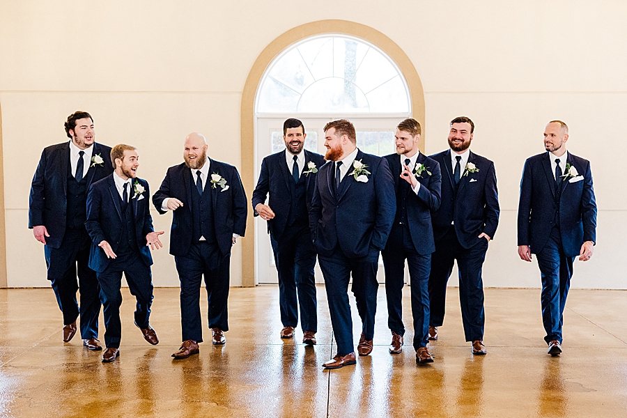 Groom and groomsmen at rainy castleton wedding
