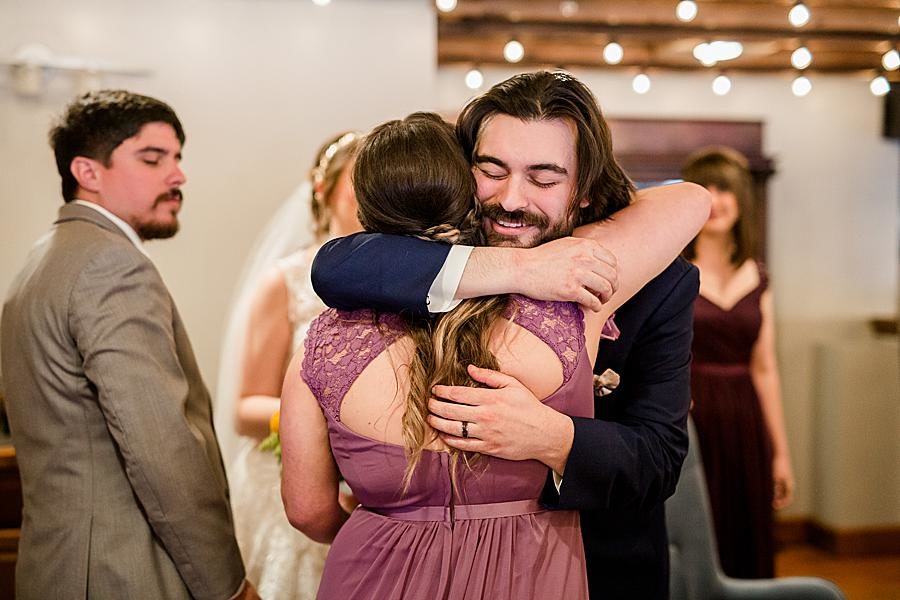 Hugs at this Relix Theater Wedding by Knoxville Wedding Photographer, Amanda May Photos.