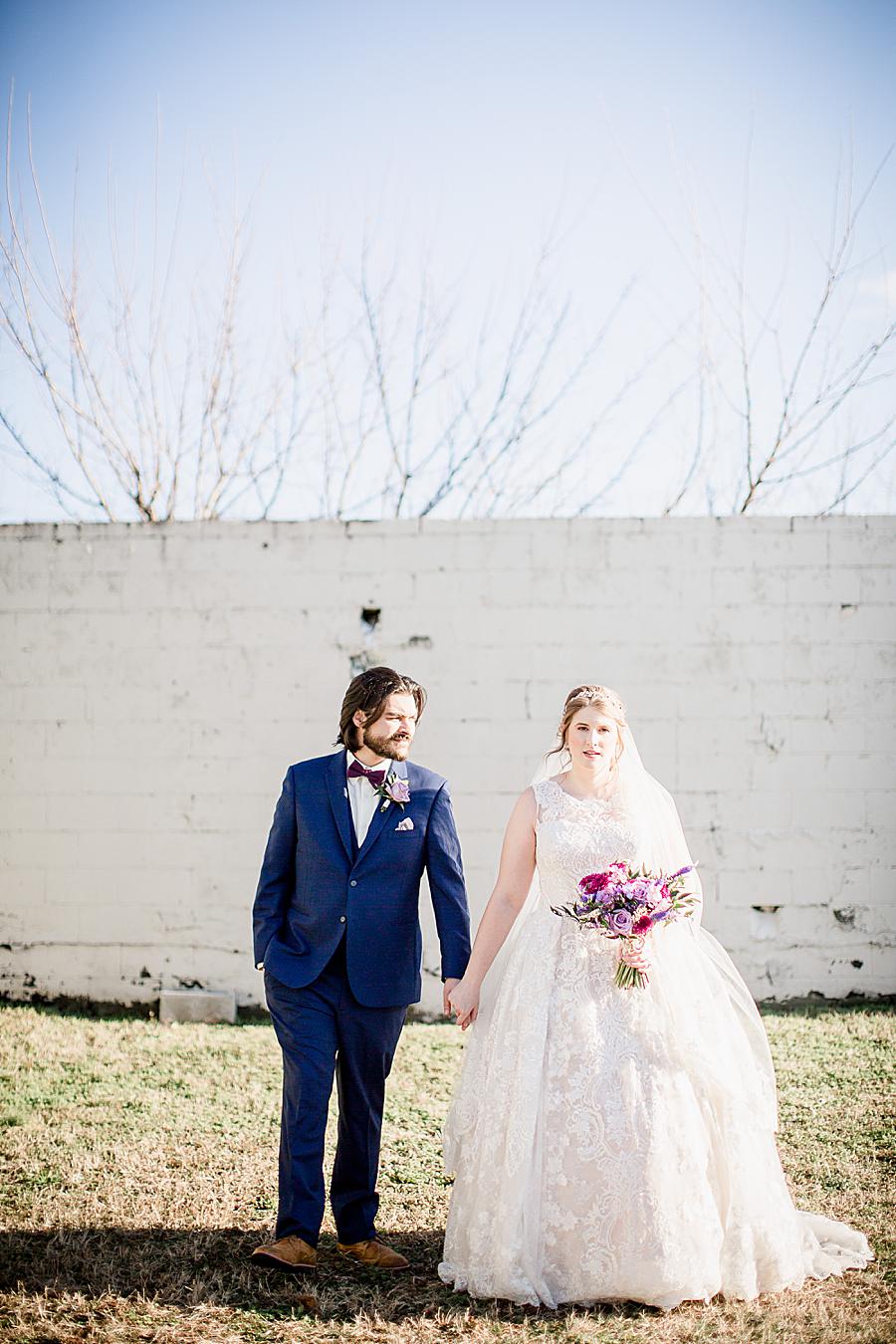 Holding hands at this Relix Theater Wedding by Knoxville Wedding Photographer, Amanda May Photos.