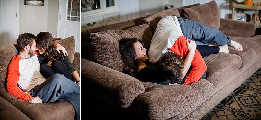 Tickling her on the couch for these lifestyle photos by Knoxville Wedding Photographer, Amanda May Photos.