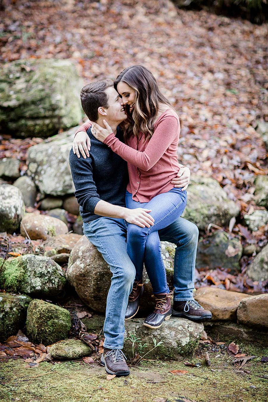 Sitting on his lap at this Smoky Mountain Engagement by Knoxville Wedding Photographer, Amanda May Photos.