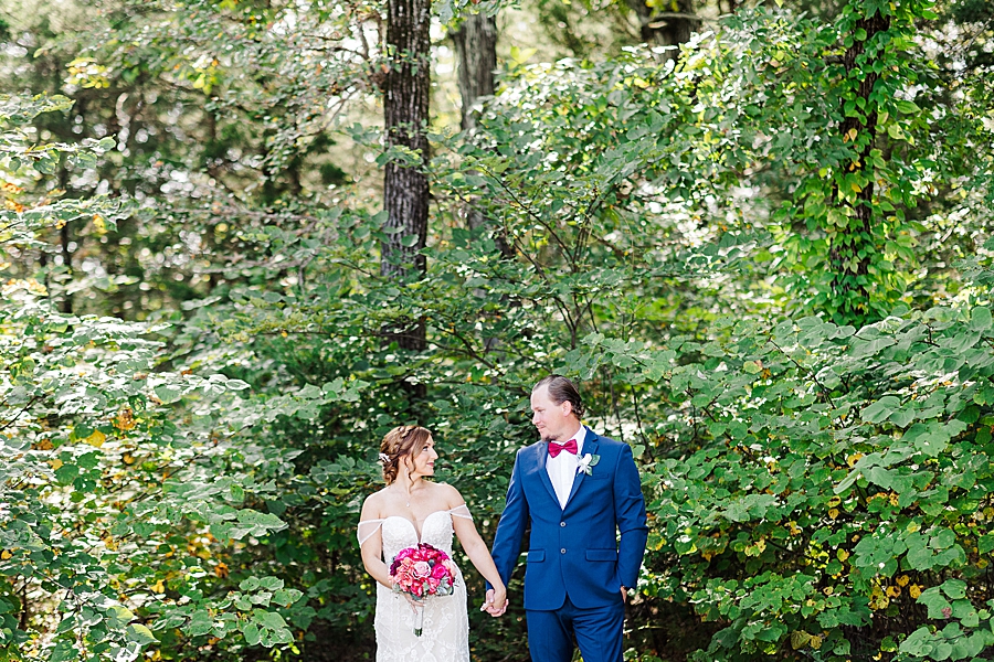 holding hands at this stone gate farm wedding