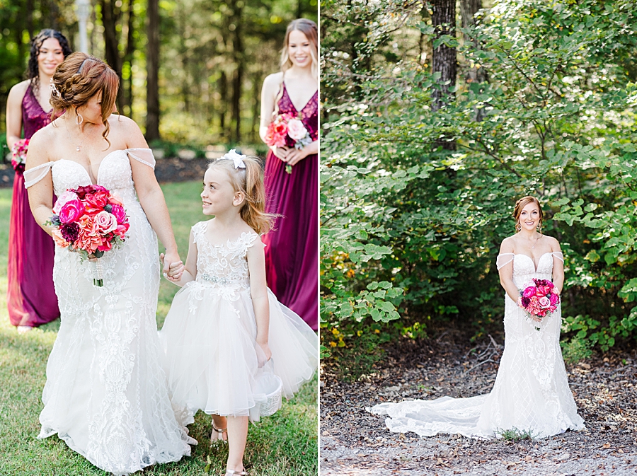 bride holding girl's hand at this stone gate farm wedding