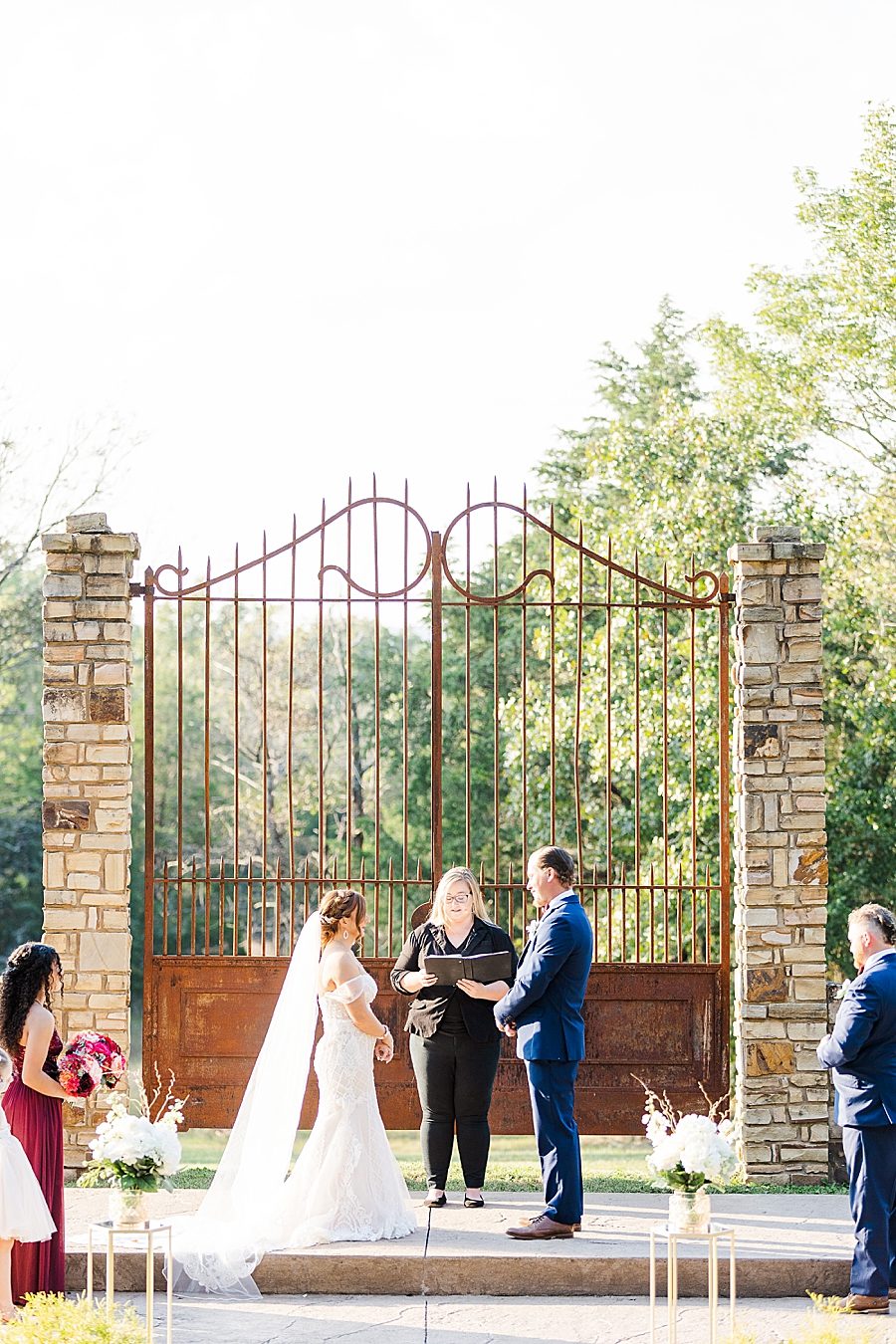 exchanging vows at this stone gate farm wedding