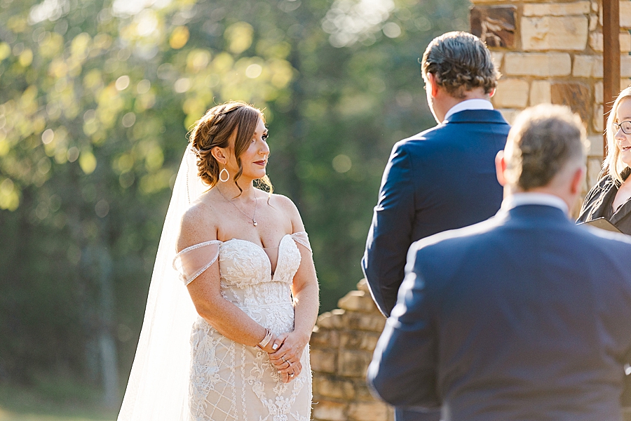 bride at ceremony at this stone gate farm wedding